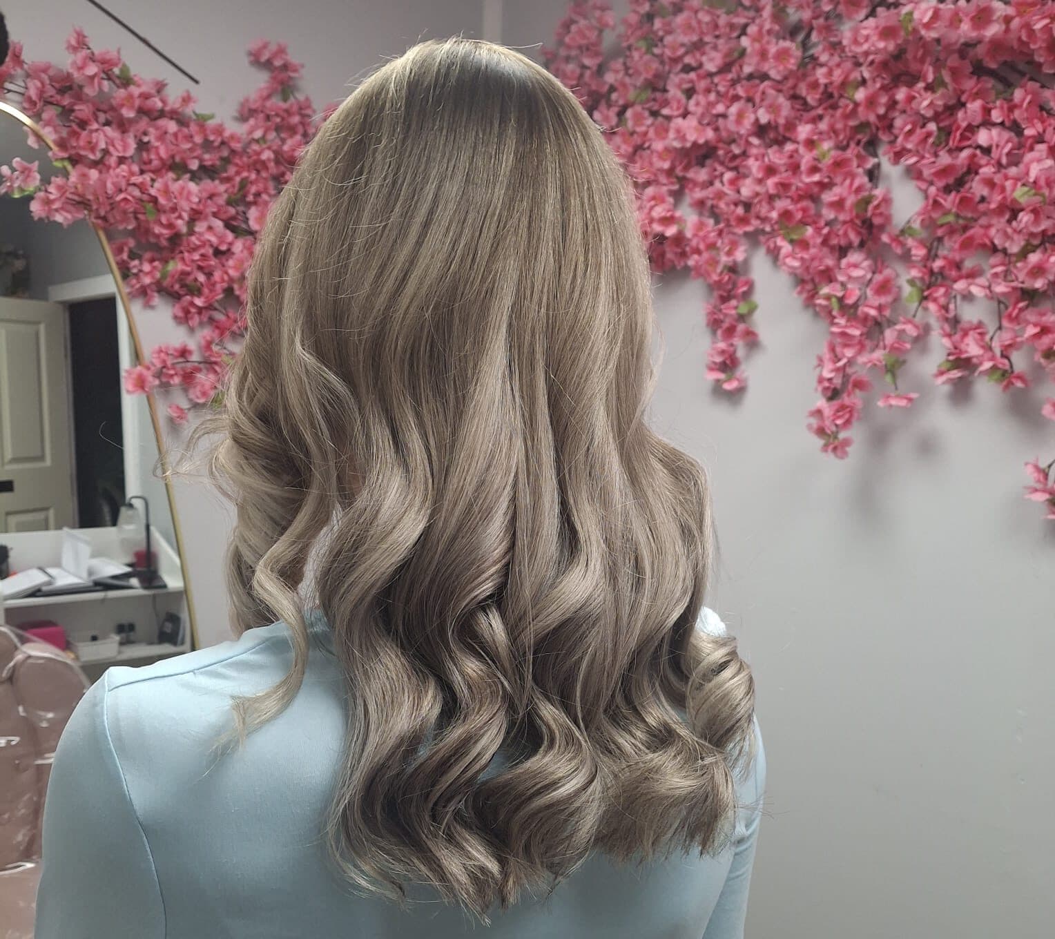 Ash blonde balayage with loose curls
