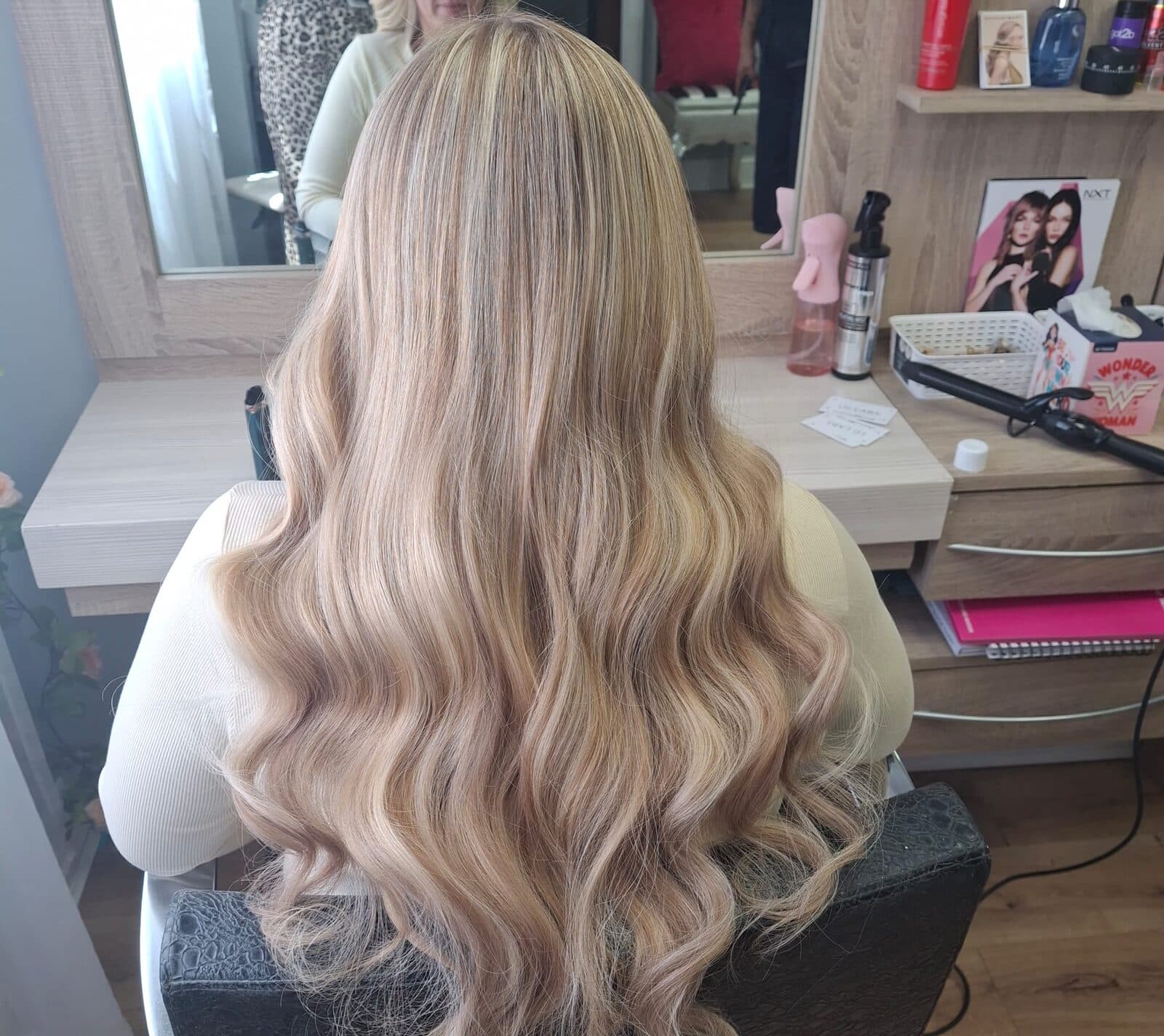 Long blonde extensions with voluminous waves