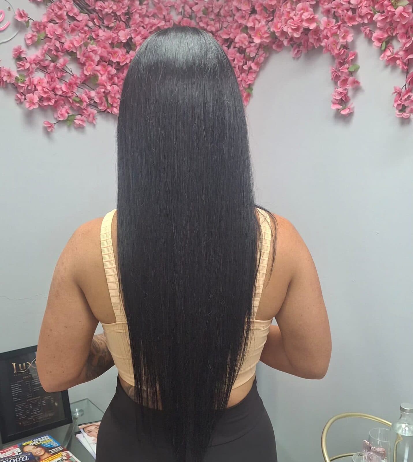 Sleek, glossy straight black hair after a smoothing treatment